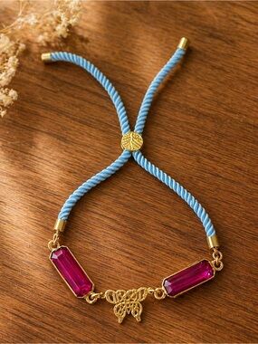 Hand Crafted Gold Butterfly Bracelet with Pink Gems and Blue Cord